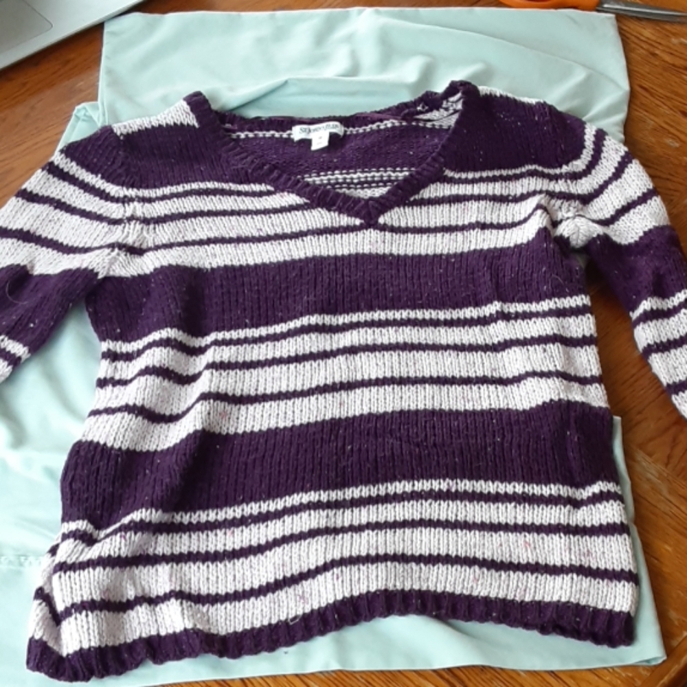 White and purple striped knitted sweater